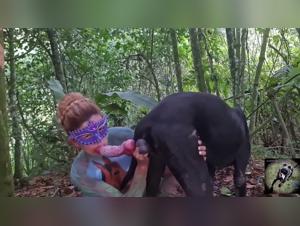 The fuck slut takes the dog in her arms and licks him
