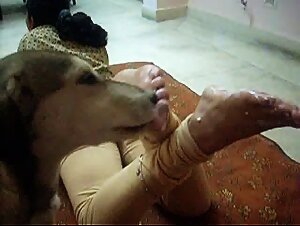 The Indian girl plays with her dog and then gets blown job by him